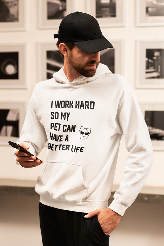 a man in a white hoodie holding a cell phone