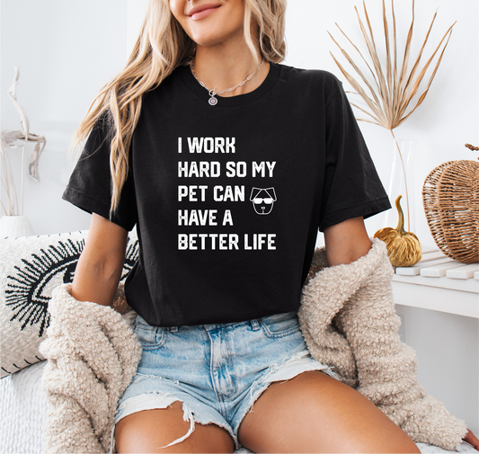 a woman sitting on a bed wearing a t - shirt that says i work hard