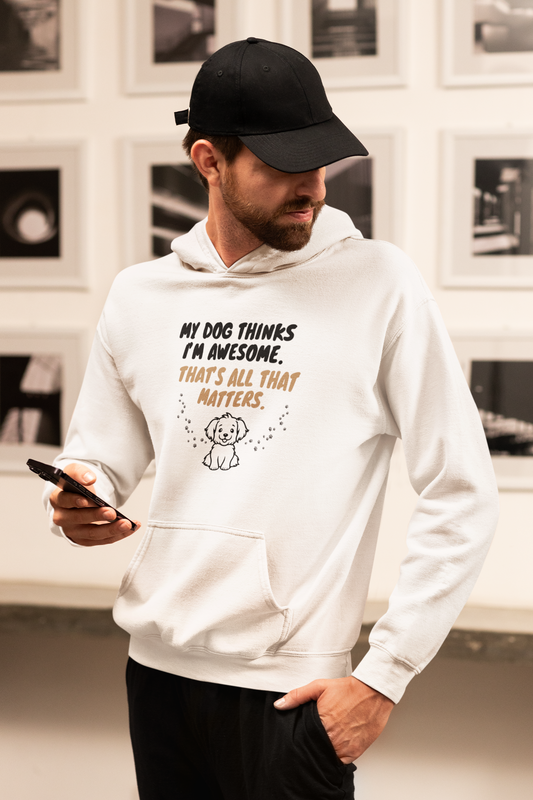 a man in a white hoodie is looking at his cell phone