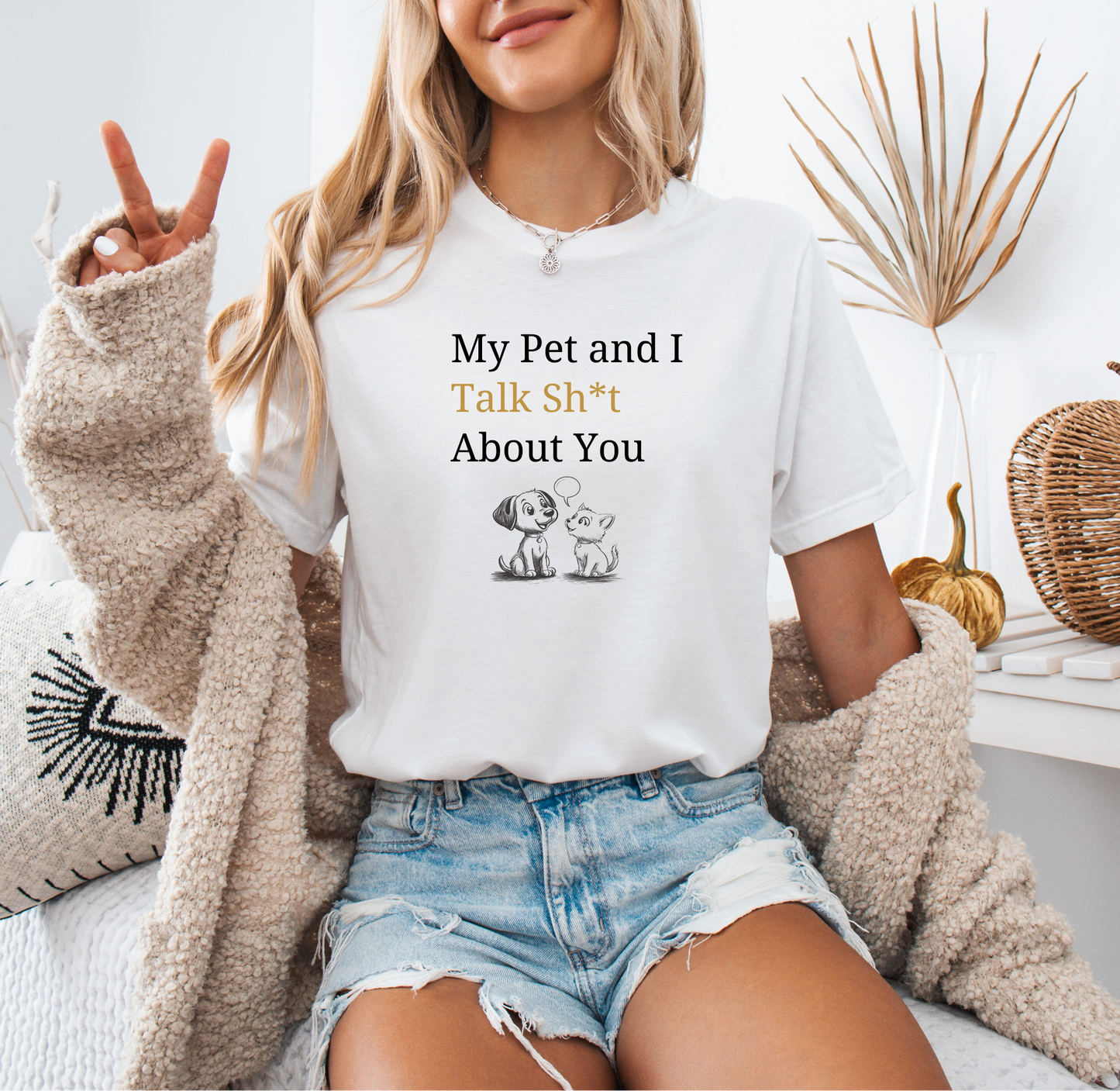 a woman sitting on a bed wearing a t - shirt that says, my pet