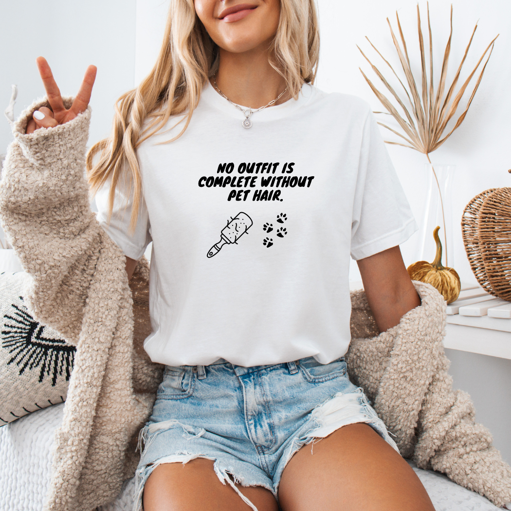 a woman sitting on a bed wearing a white shirt